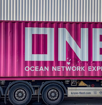 a pink truck with the word ocean network express painted on it